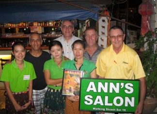 Tuesday’s winners pose for a photo with the staff at The Relax Bar.